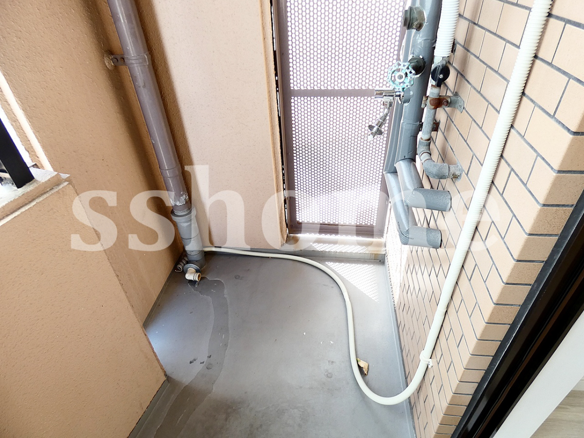 個室 洗濯機はこちらへ 写真19